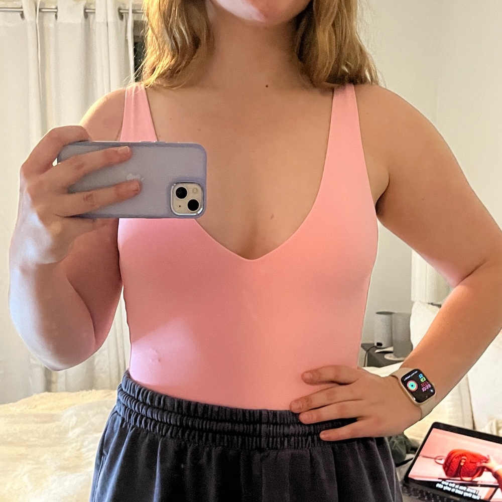 pink aritzia low cut bodysuit